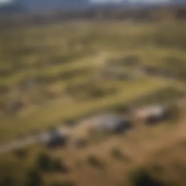 Aerial View of Diverse Ranch Terrain Aerial view of a sprawling ranch landscape showcasing diverse terrain and livestock.