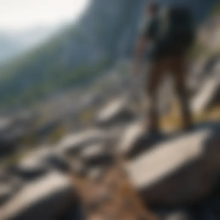 Hiker navigating a rocky terrain with a stunning backdrop.